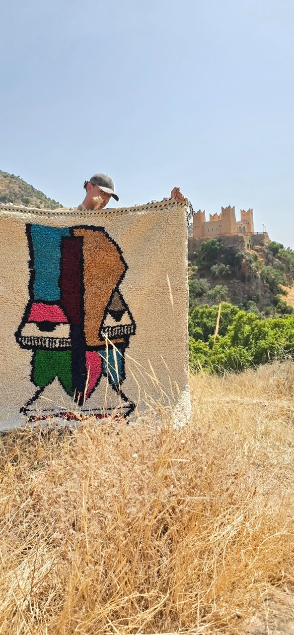 Art-shaped Moroccan rug displayed outdoors